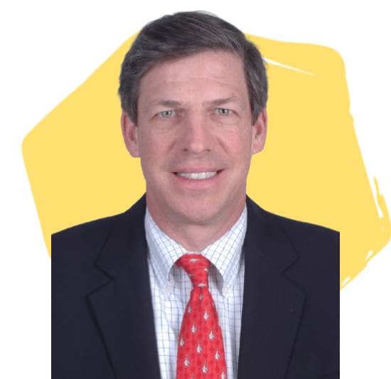 Leighton Welch, Board Director, in front of a yellow hexagon.